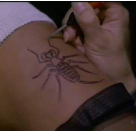 Tatoo Needle, being used to create a scorpion design
